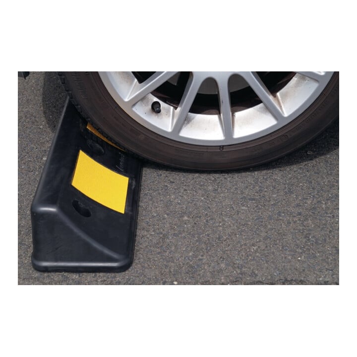 Blocage de roue L500xl160xH100mm PVC noir avec bandes réfléchiss. jaunes